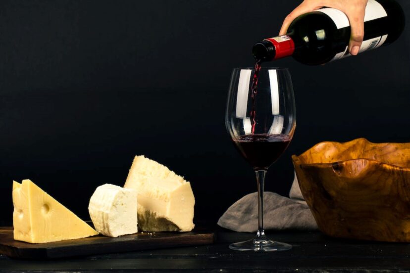 Person Pouring Wine into Glass
